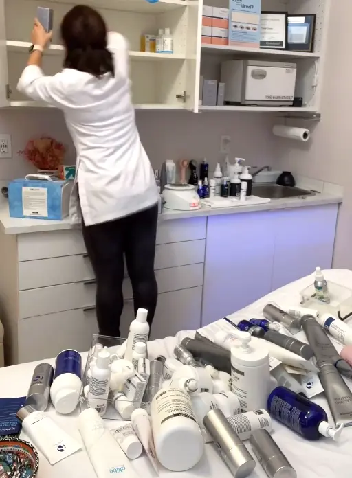 Women Spring Cleaning Her Skincare Products